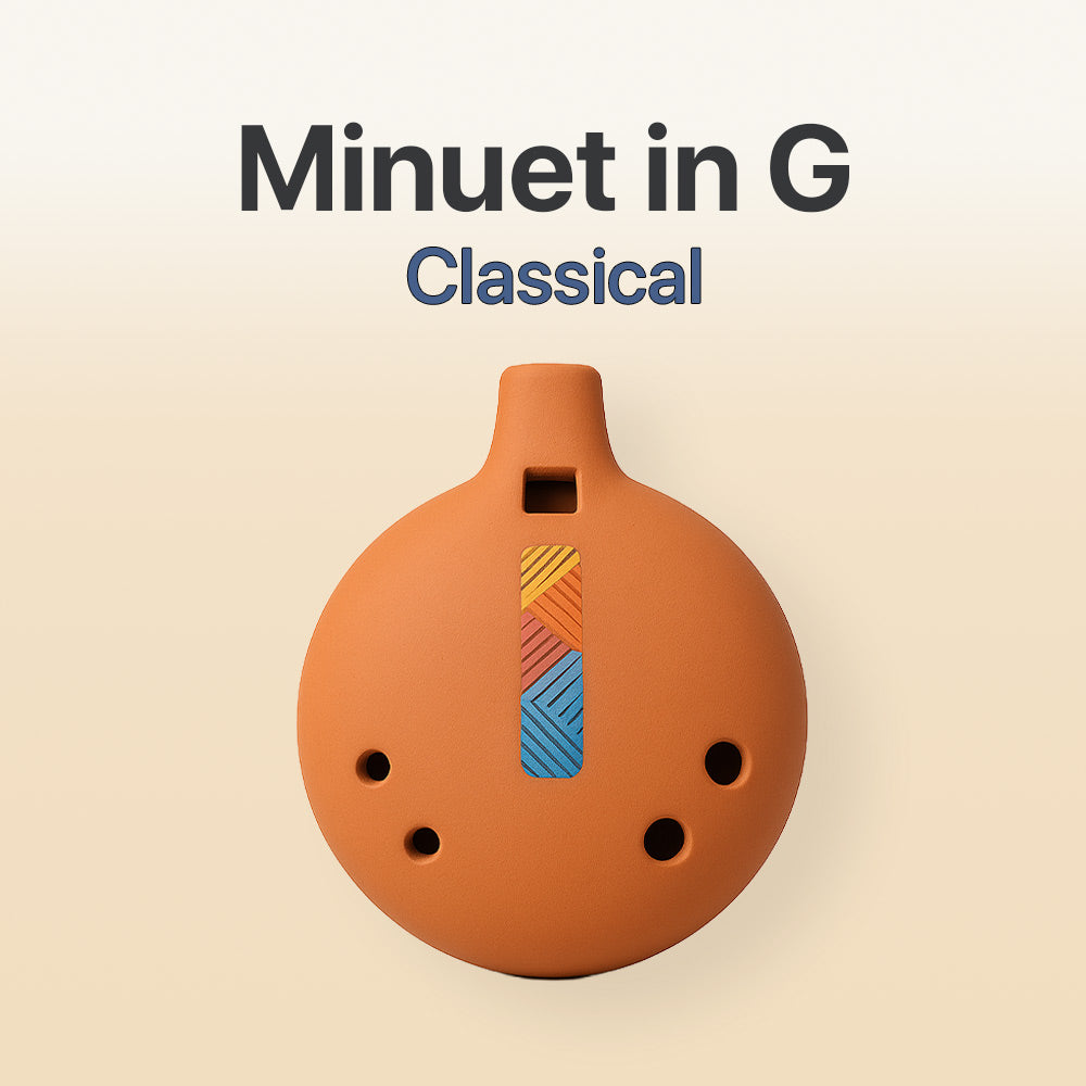 Ceramic ocarina with colorful design on a beige background, labeled 'Minuet in G Classical'.