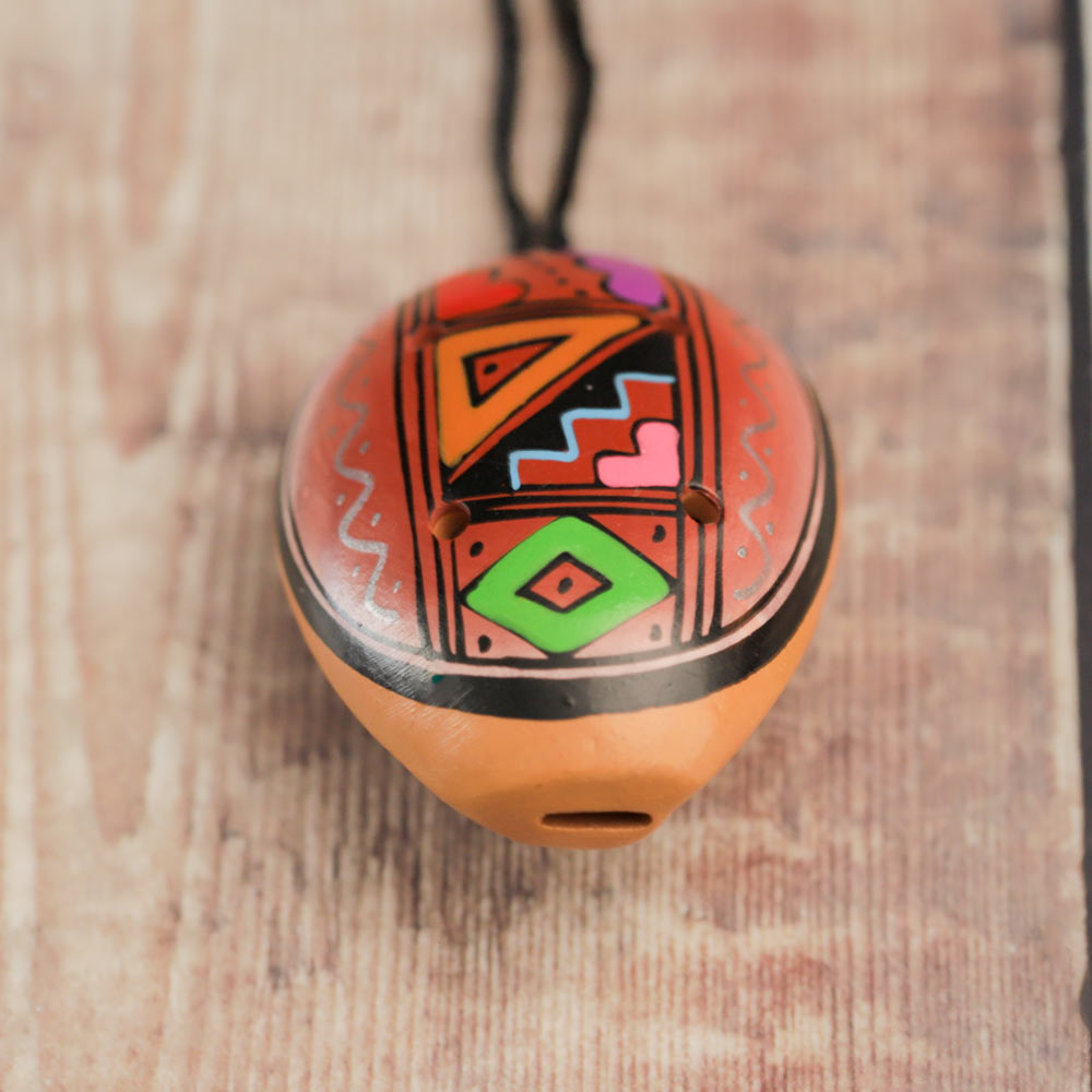 close up of ocarina pendant 