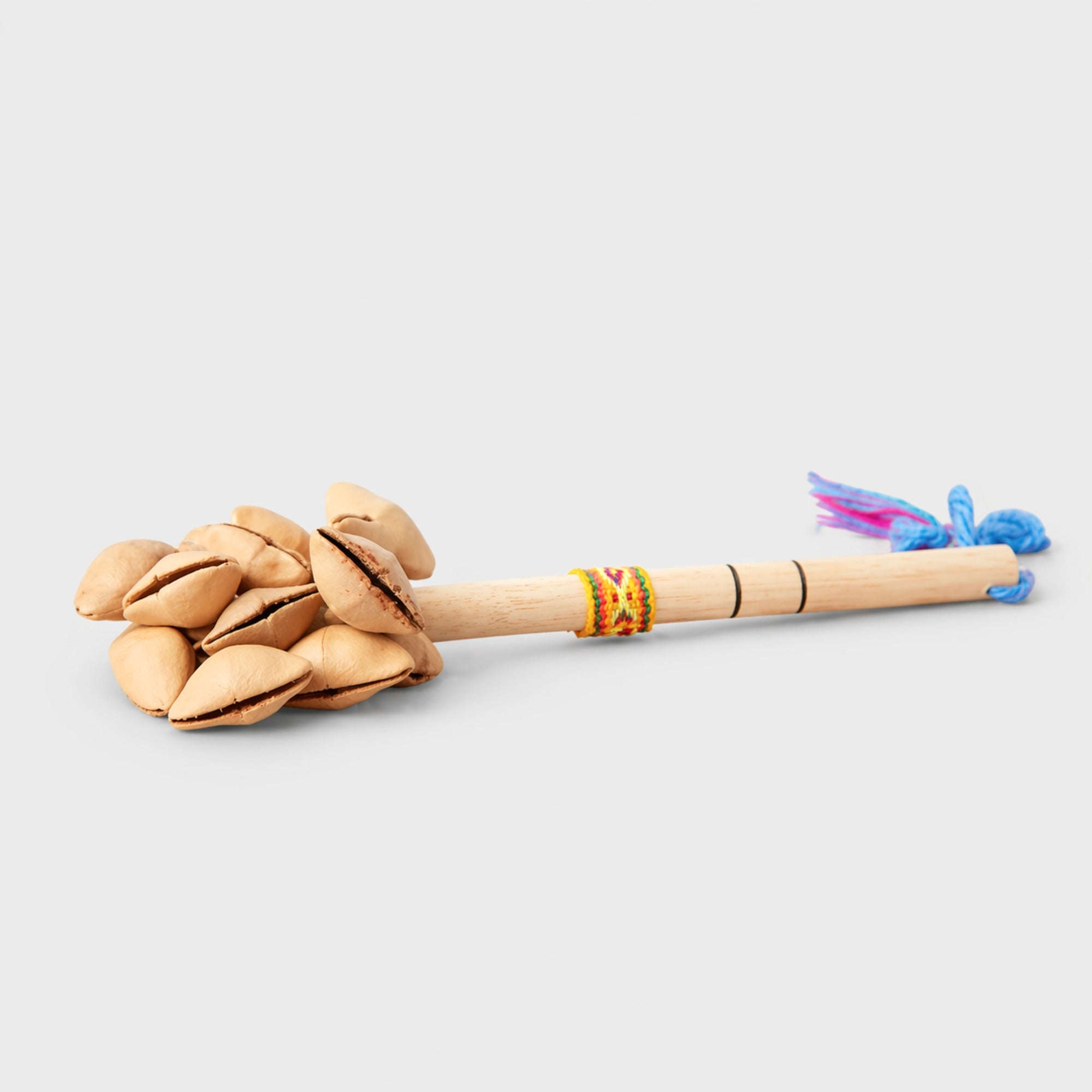 wooden stick with kenari seed and Peruvian rope rattle 