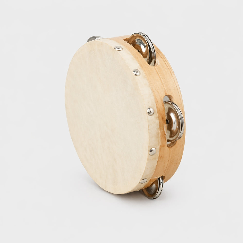 Wooden tambourine on a light gray background