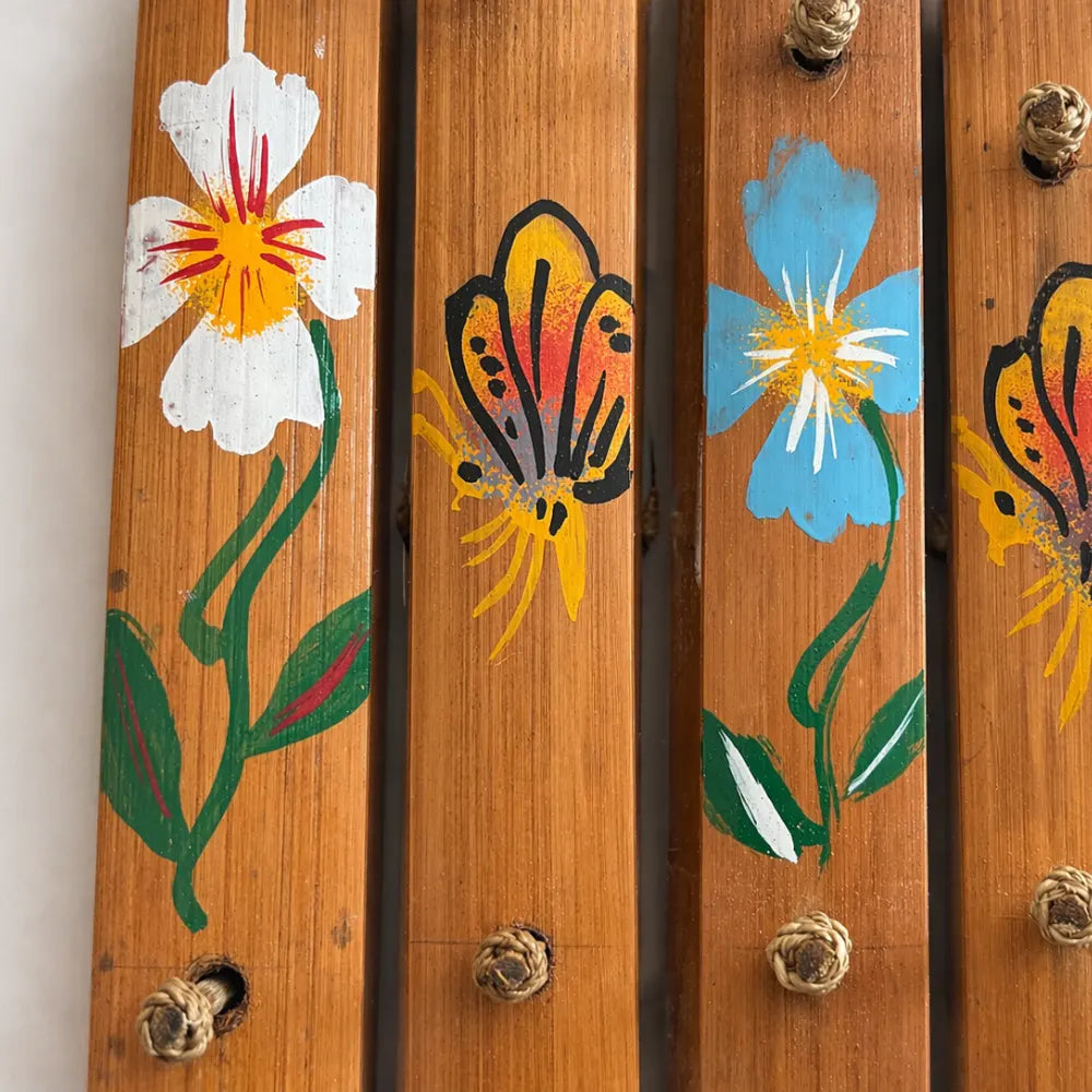 close up of floral and animal paintings on Rindik bung 