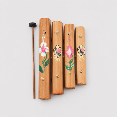 wooden xylophone with floral paintings grey background 