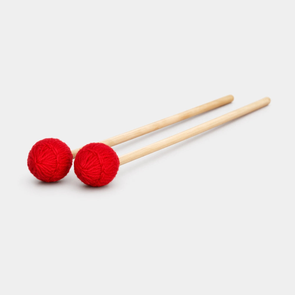 Two red mallets with wooden handles on a white background