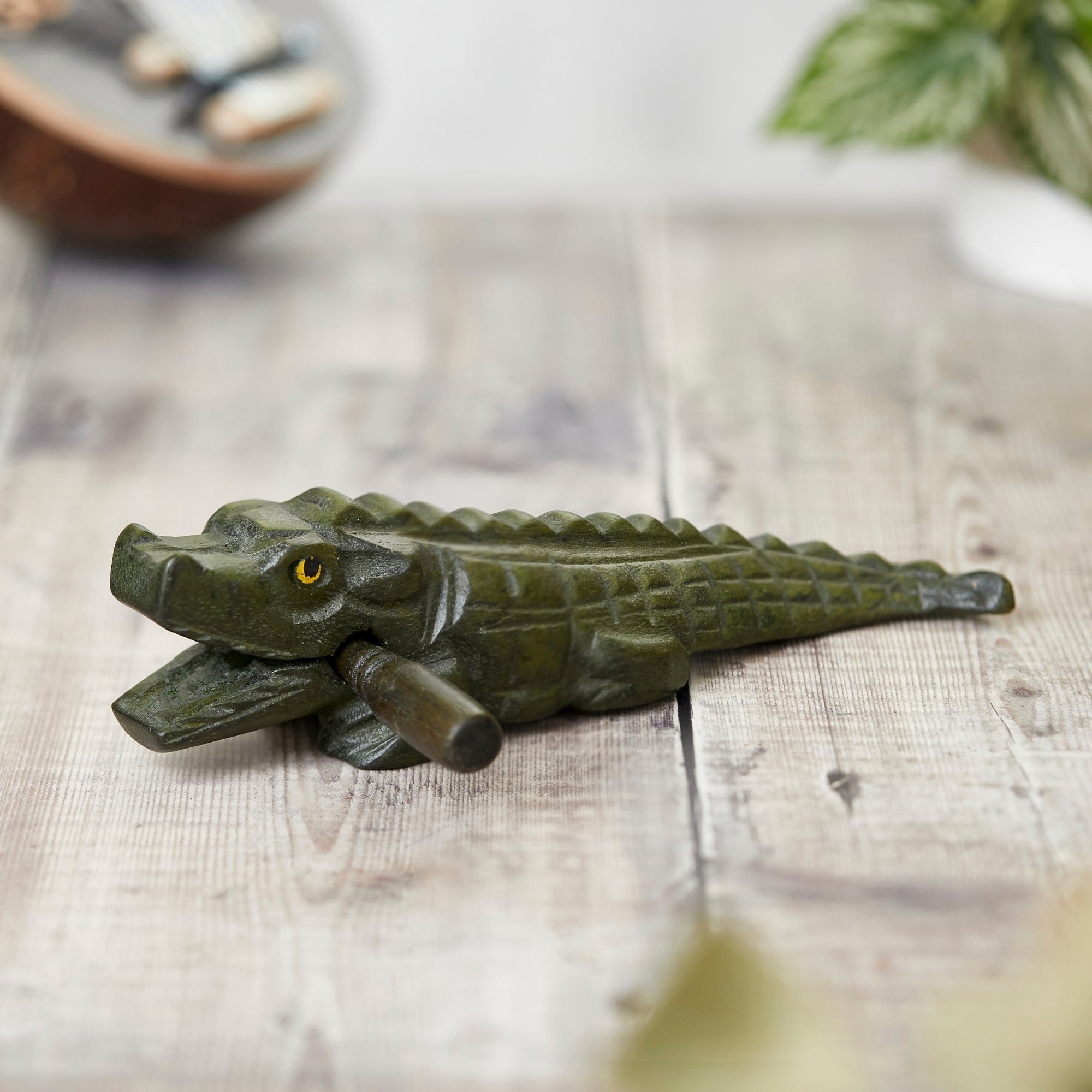 Solid green crocodile guiro with beater