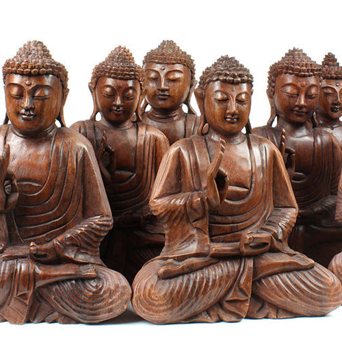 large bundle of carved sitting buddhas 