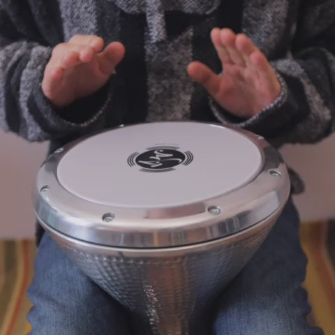 Man playing the large Turkish doumbek drum