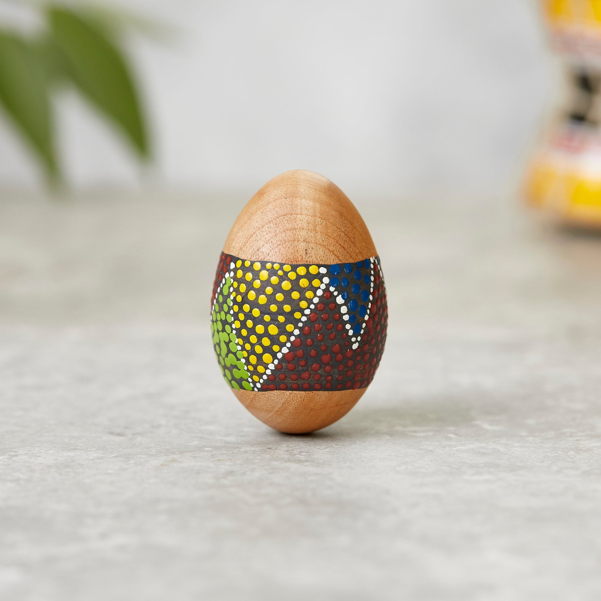 Solid wood egg shaker with dot painted design 