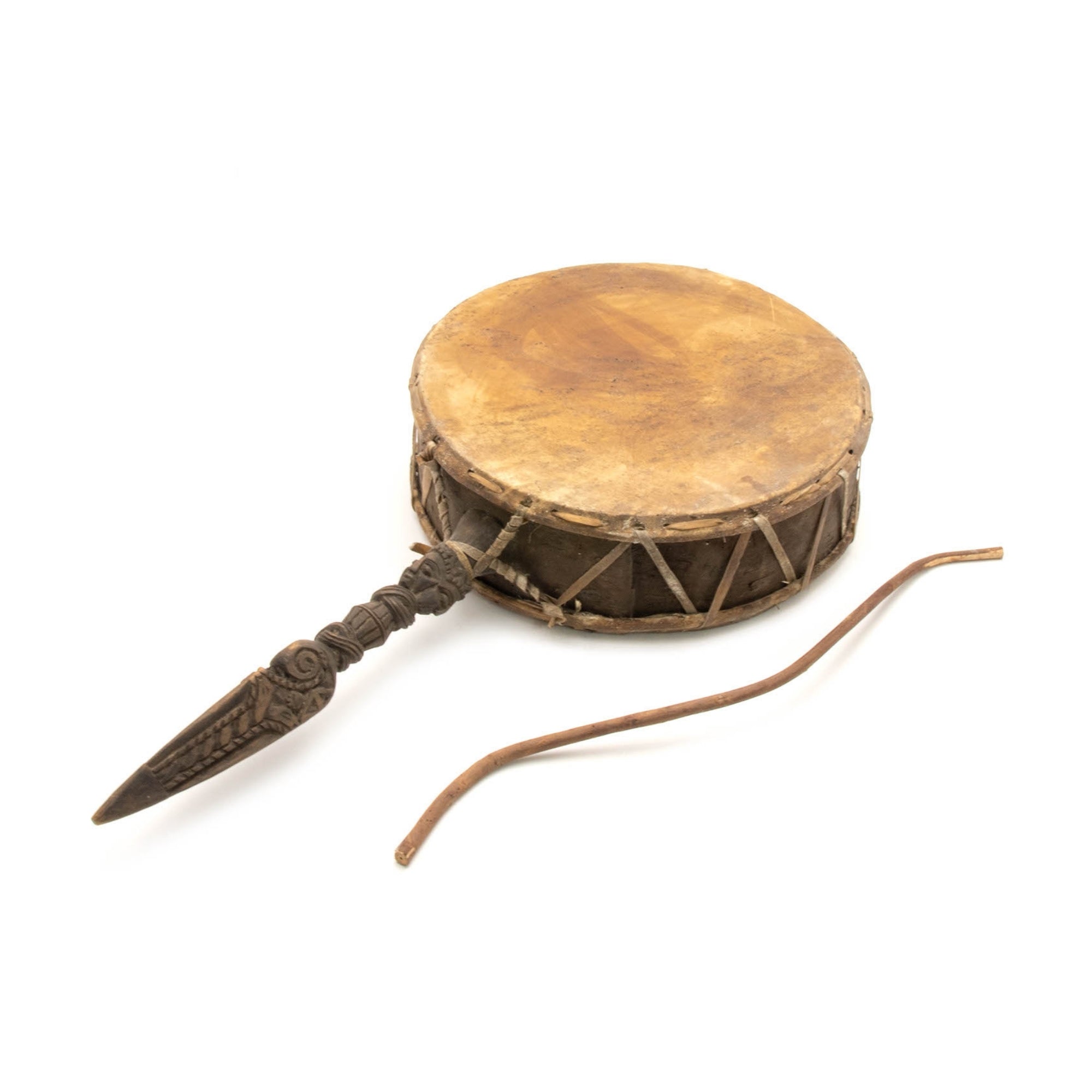 nepalese shamanic drum laying shot with beater