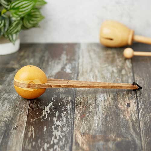 yellow wooden gourd shaker