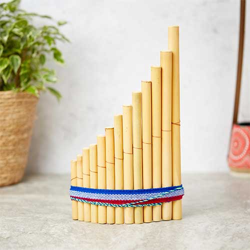 pan pipes with blue ribbon