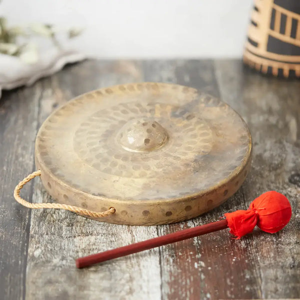 brass gong with hanging loop and handmade beater