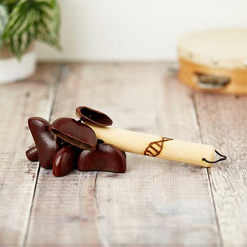 small wooden seed shaker with fish carving